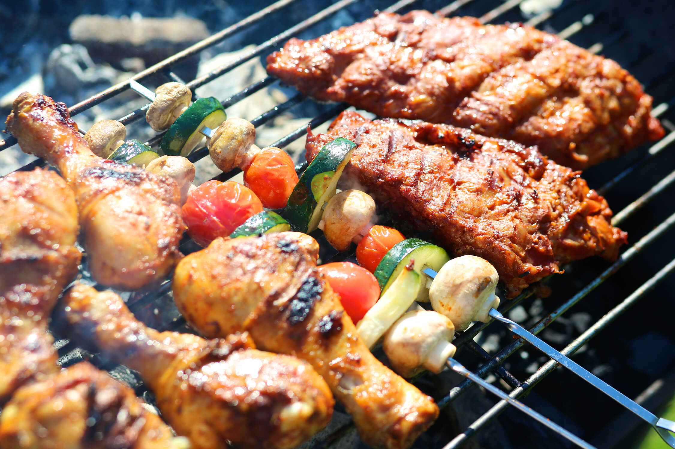 Food being grilled over charcoal
